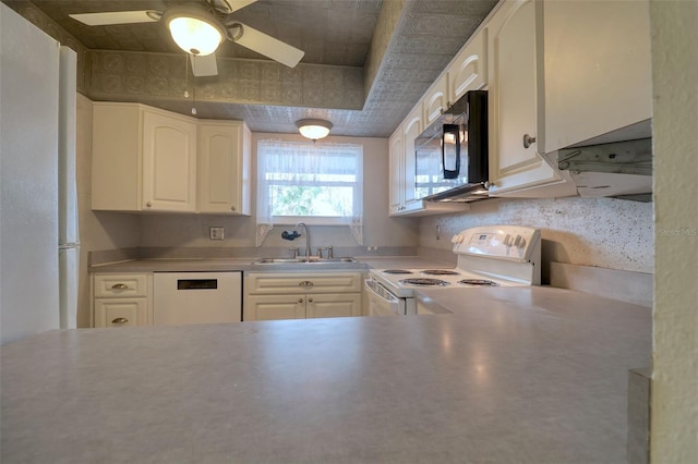 kitchen featuring light countertops, white cabinetry, a sink, ceiling fan, and white appliances