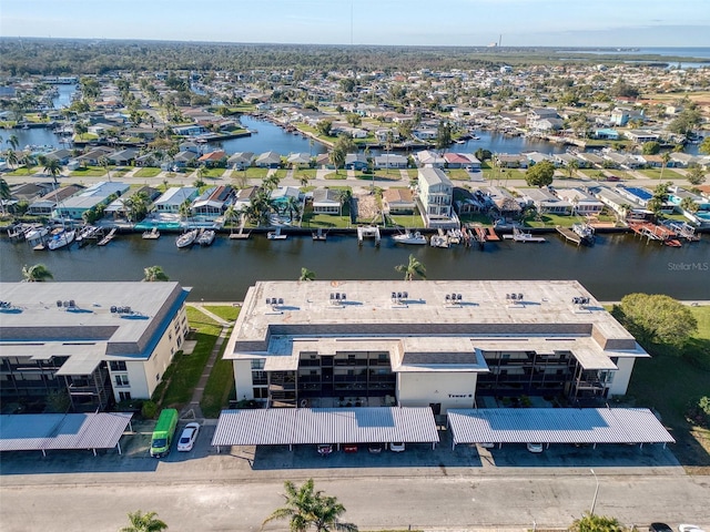 aerial view featuring a water view and a residential view