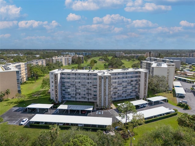birds eye view of property with a view of city