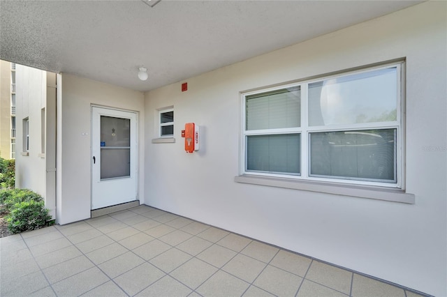 doorway to property with a patio area