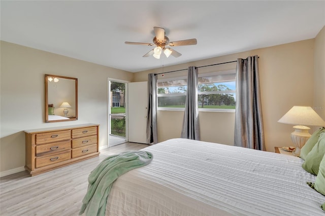 bedroom with access to outside, ceiling fan, and light wood-type flooring