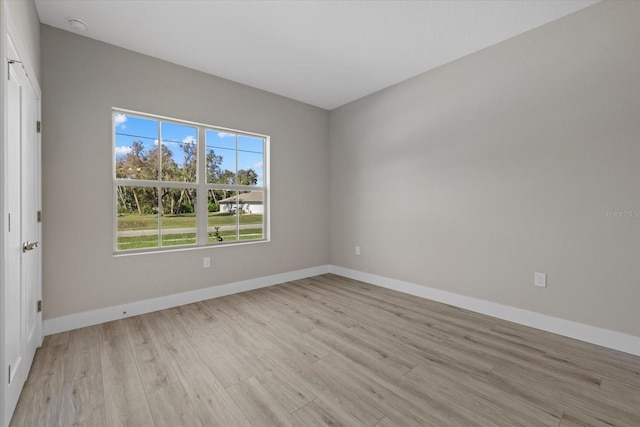 spare room with light wood-type flooring