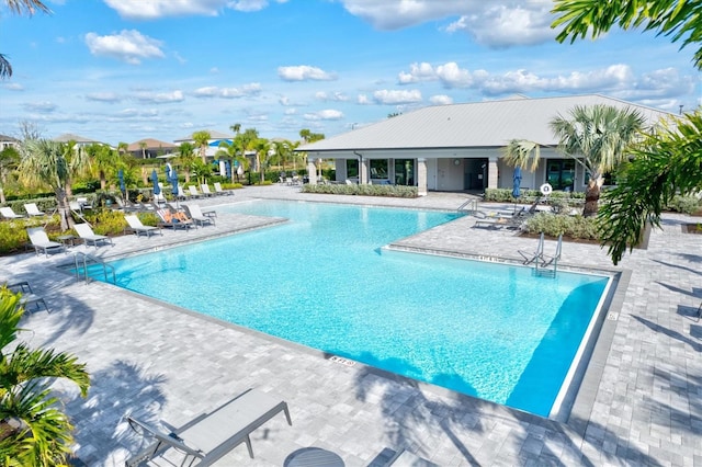 view of swimming pool with a patio area