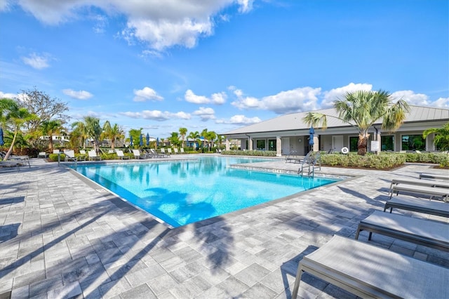 view of swimming pool featuring a patio area