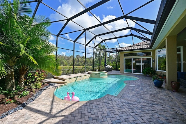 view of swimming pool with glass enclosure, an in ground hot tub, and a patio