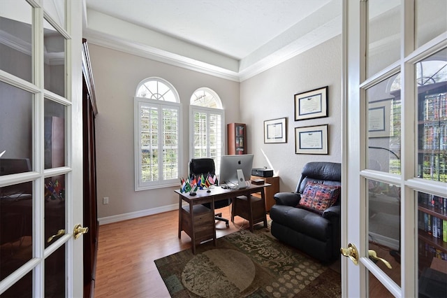 10209 Discovery Ter, Bradenton, FL 34212 - home office with french doors, wood finished floors, and baseboards