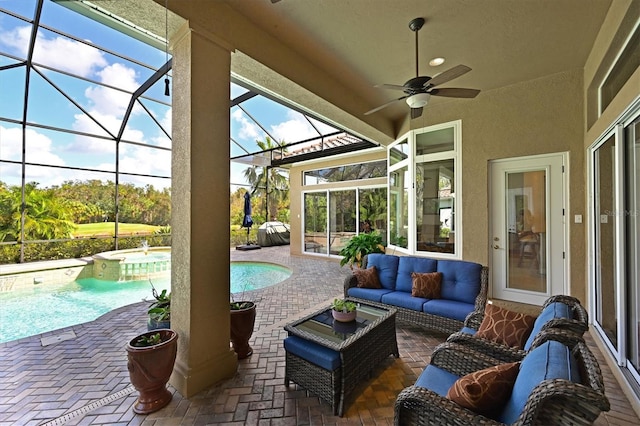 view of patio / terrace featuring glass enclosure, an outdoor pool, ceiling fan, a hot tub, and an outdoor hangout area