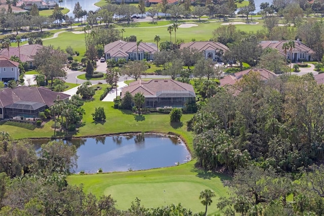 aerial view featuring a residential view, a water view, and view of golf course