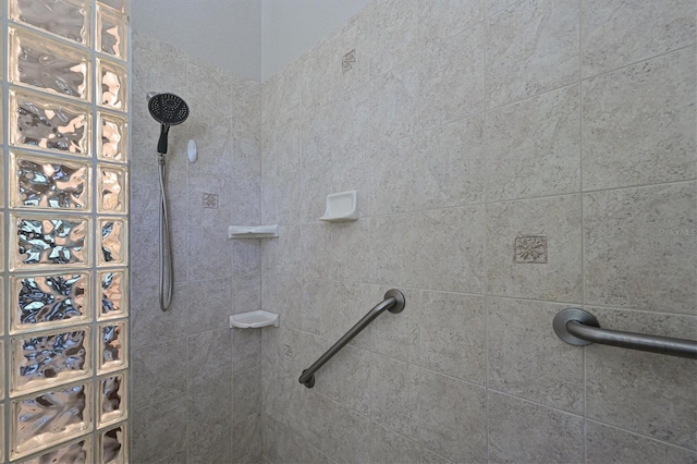 full bathroom with a tile shower