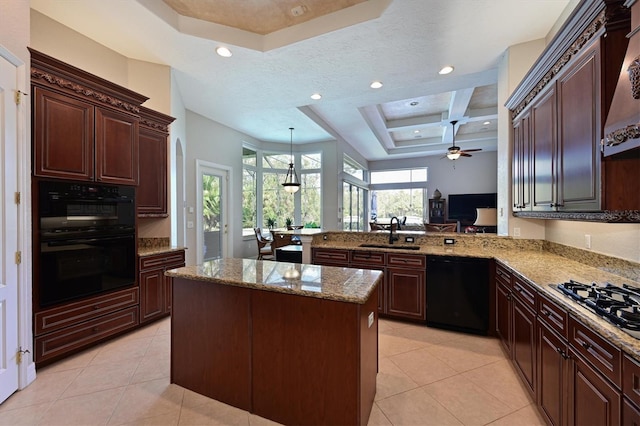 kitchen with a sink, light stone counters, black appliances, and light tile patterned floors