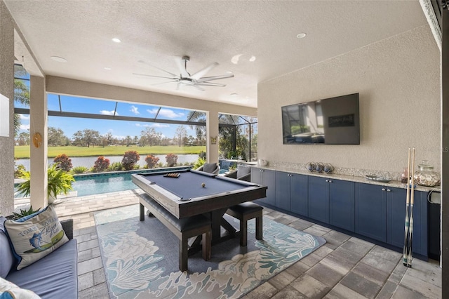 game room featuring ceiling fan, a textured ceiling, and pool table