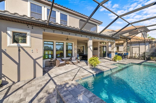 back of property featuring a patio, ceiling fan, and a lanai