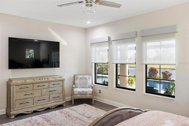 bedroom featuring ceiling fan and dark wood-type flooring