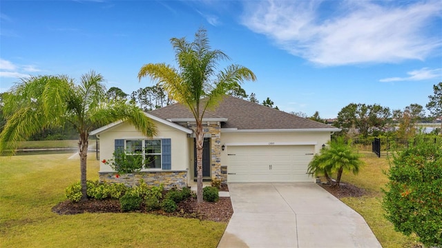 ranch-style home featuring a garage and a front lawn