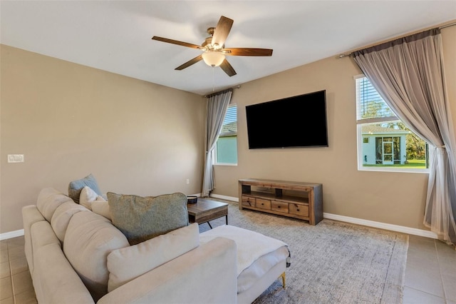 tiled living room with ceiling fan