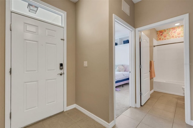 entrance foyer featuring light tile patterned floors