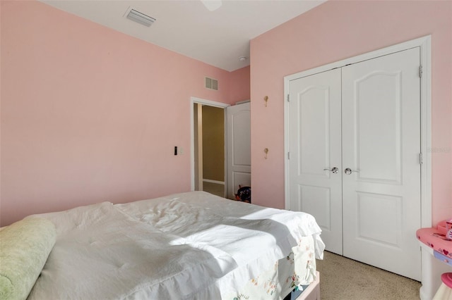 carpeted bedroom with a closet