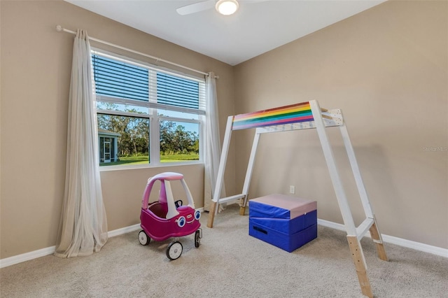 rec room featuring ceiling fan and light colored carpet