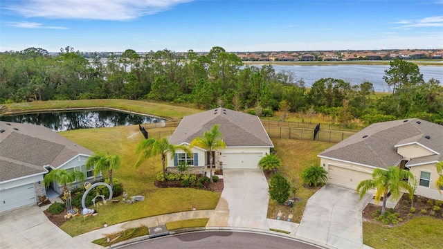 birds eye view of property with a water view