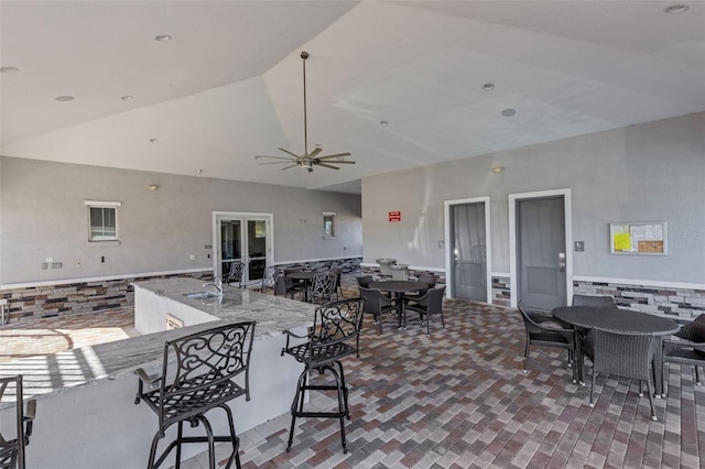 view of patio / terrace with ceiling fan and sink