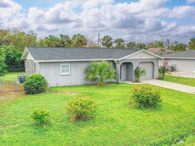 single story home featuring a garage and a front yard