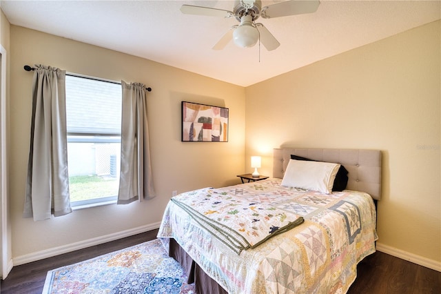 bedroom featuring ceiling fan and dark hardwood / wood-style floors