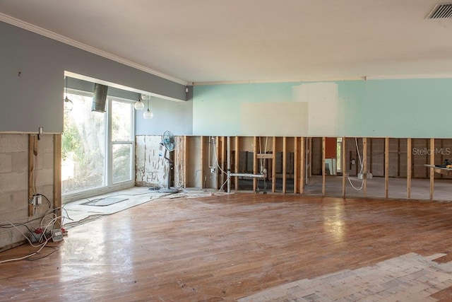 miscellaneous room with hardwood / wood-style flooring and ornamental molding