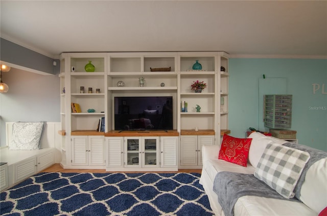 living room featuring light hardwood / wood-style floors and crown molding