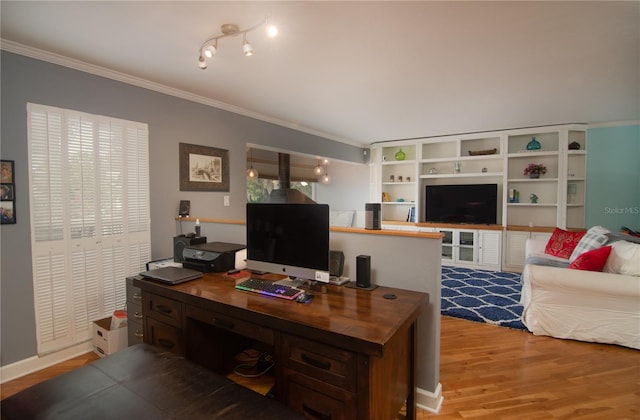 office with light wood-type flooring and crown molding