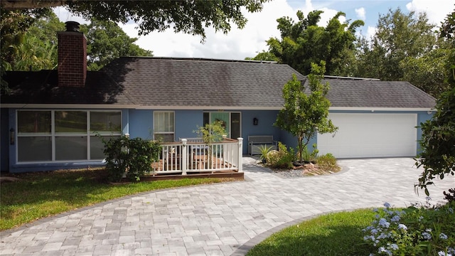 ranch-style home featuring a garage