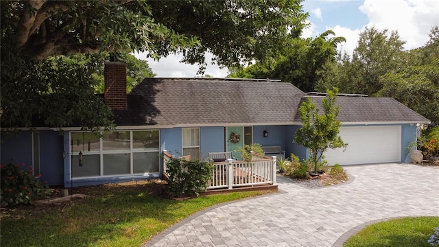 view of front of home featuring a garage and covered porch