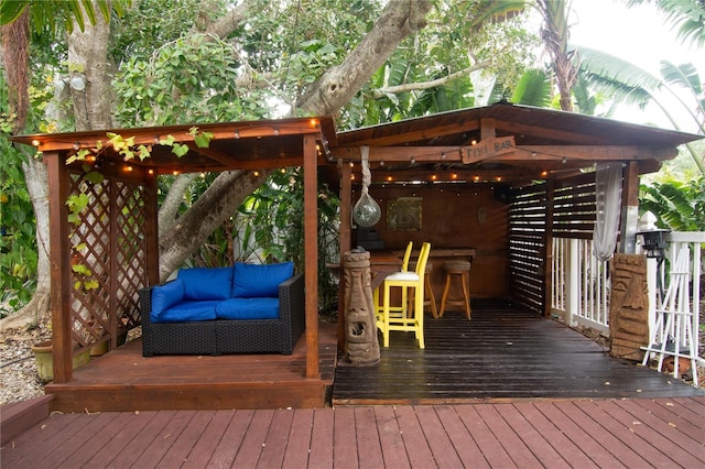 wooden terrace featuring an outdoor bar