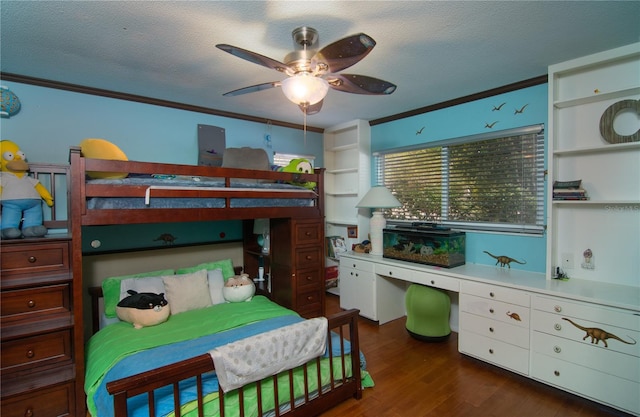 bedroom with ceiling fan, crown molding, a textured ceiling, and dark hardwood / wood-style flooring