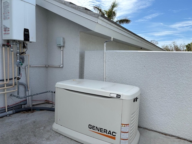 details featuring water heater and concrete floors