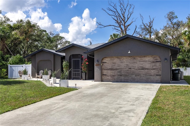 single story home featuring a garage and a front lawn