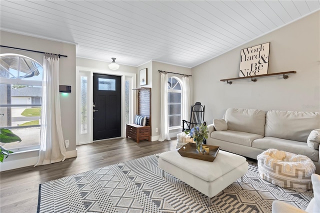 living room with wooden ceiling, lofted ceiling, crown molding, and dark hardwood / wood-style flooring