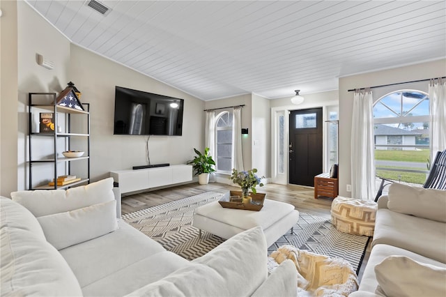 living room with wooden ceiling, light hardwood / wood-style flooring, and lofted ceiling