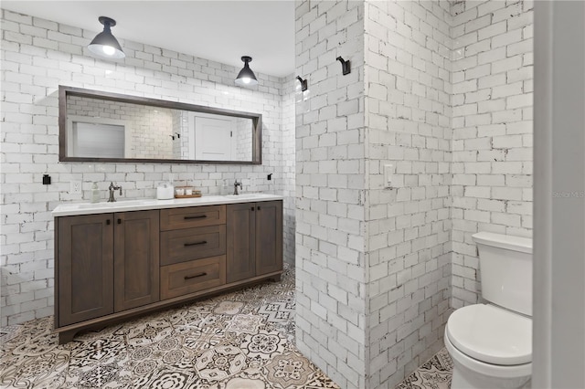 bathroom featuring toilet, vanity, and tile patterned floors