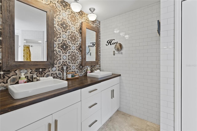 bathroom featuring a shower, vanity, backsplash, and tile walls