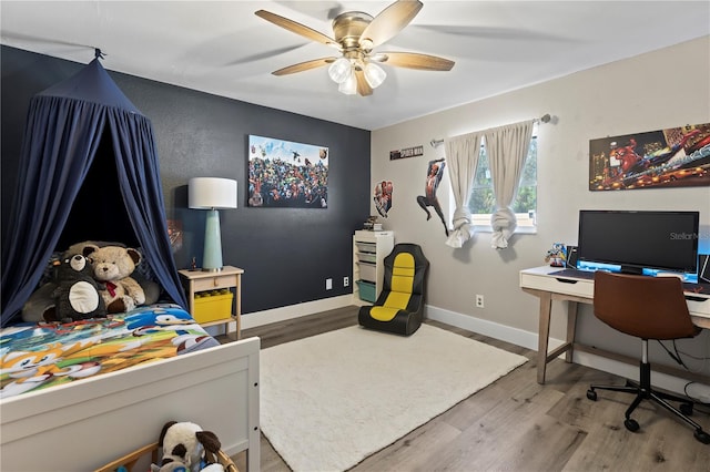 office area with hardwood / wood-style flooring and ceiling fan