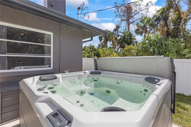 deck with a hot tub