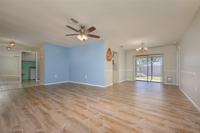 unfurnished living room with a textured ceiling, light hardwood / wood-style flooring, and ceiling fan with notable chandelier