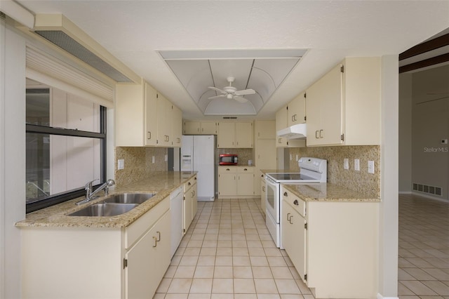 kitchen with white appliances, sink, ceiling fan, light tile patterned floors, and tasteful backsplash