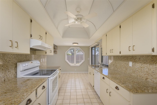 kitchen with white cabinetry, sink, light tile patterned floors, and white appliances