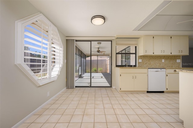 kitchen featuring ceiling fan, dishwasher, cream cabinetry, decorative backsplash, and light tile patterned floors