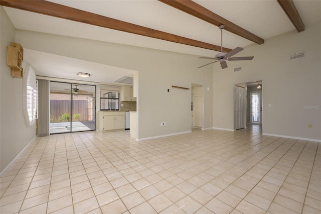 unfurnished living room featuring ceiling fan, beamed ceiling, light tile patterned floors, and high vaulted ceiling