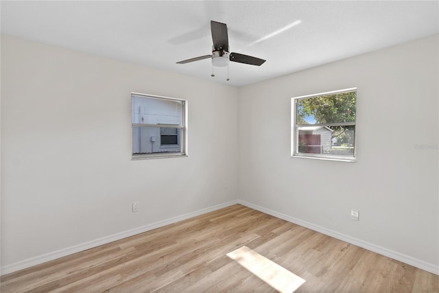 spare room featuring ceiling fan and light wood-type flooring