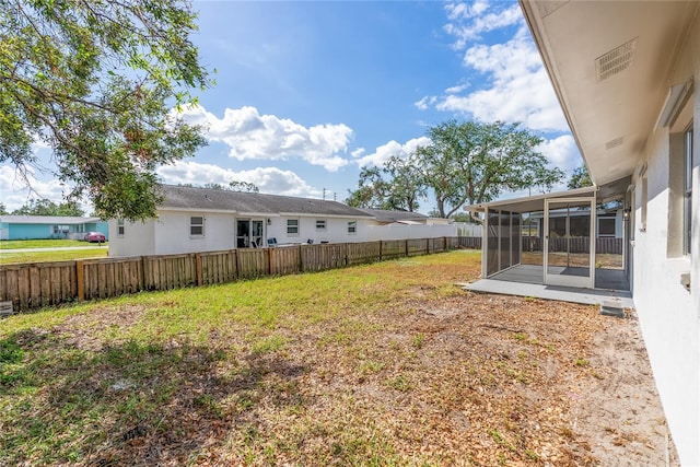 view of yard with a sunroom