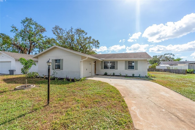 ranch-style house with a garage and a front yard