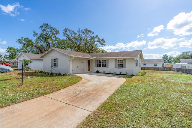 ranch-style house with a garage and a front lawn